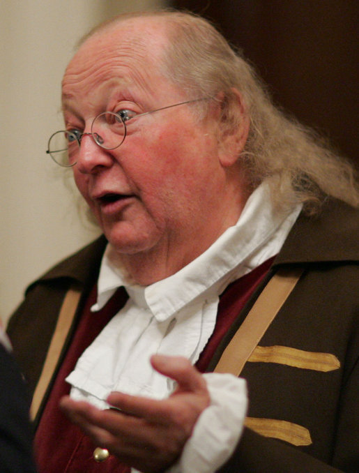 Benjamin Franklin interpreter, Ralph Archbold of Philadelphia, Pa., speaks with guests Thursday evening, March 23, 2006 in the Blue Room of the White House, at a Social Dinner hosted by President George W. Bush and Mrs. Laura Bush to honor the 300th birthday of Benjamin Franklin. White House photo by Paul Morse