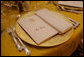 The dinner setting for Mrs. Laura Bush is seen Thursday evening, March 23, 2006 in the Blue Room of the White House, set a Social Dinner hosted by President George W. Bush and Mrs. Bush in honor of the 300th Birthday of Benjamin Franklin White House photo by Shealah Craighead