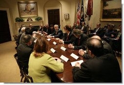 President George W. Bush speaks with participants in a meeting on immigration reform Thursday, March 23, 2006, in the Roosevelt Room of the White House.  White House photo by Eric Draper