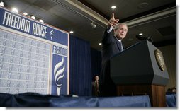 President George W. Bush takes a question from the audience at Freedom House, Wednesday, March 29, 2006 in Washington, where President Bush discussed Democracy in Iraq and thanked the Freedom House organization for their work to expand freedom around the world. White House photo by Eric Draper