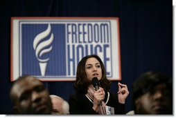 An audience member directs a question to President George W. Bush during his appearance at Freedom House, Wednesday, March 29, 2006 in Washington, where President Bush discussed Democracy in Iraq and thanked the Freedom House organization for their work to expand freedom around the world. White House photo by Eric Draper