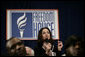 An audience member directs a question to President George W. Bush during his appearance at Freedom House, Wednesday, March 29, 2006 in Washington, where President Bush discussed Democracy in Iraq and thanked the Freedom House organization for their work to expand freedom around the world. White House photo by Eric Draper