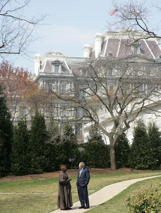 President George W. Bush speaks with Nigerian President Olusegun Obasanjo on the South Lawn Wednesday, March 29, 2006, during his visit to the White House. White House photo by Shealah Craighead