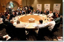 President George W. Bush, center, attends the Security and Prosperity Partnership meeting with Mexico's President Vicente Fox, right, and Canadian Prime Minister Stephen Harper, left, Friday, March 31, 2006 at the Fiesta Americana Condesa Cancun Hotel in Cancun, Mexico.  White House photo by Eric Draper