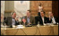 President George W. Bush is seated next to Robert J. Stevens, president and CEO of Lockheed Martin, right, during a meeting with Canadian Prime Minister Stephen Harper and Mexico's President Vicente Fox, in a roundtable discussion with U.S., Mexican and Canadian business leaders, Friday, March 31, 2006 at the Fiesta Americana Condesa Cancun Hotel. White House photo by Eric Draper