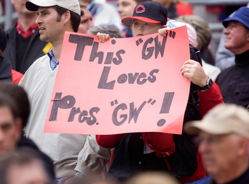 A young Reds fan tries to get President Bush’s attention during the opening game between the Cincinnati Reds and the Chicago Cubs in Cincinnati, Ohio, Monday, April 3, 2006. White House photo by Kimberlee Hewitt