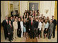 President George W. Bush stands with members of the Auburn University Men and Women’s Swimming and Diving Team Thursday, April 6, 2006, during a photo opportunity with the 2005 and 2006 NCAA Sports Champions. White House photo by Paul Morse