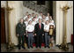 President George W. Bush stands with members of the U.S. Military Academy Rifle Team Thursday, April 6, 2006, during a photo opportunity with the 2005 and 2006 NCAA Sports Champions. White House photo by Eric Draper