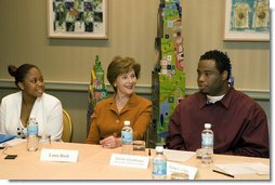 Mrs. Laura Bush listens to Jeremy Greathouse, an unemployed New Orleans youth, and LaToya Dorsha Williams, an Urban League participant, about difficulties of life experiences and employment during a discussion with the National Urban League in New Orleans, La., Monday, April 10, 2006. Urban League affiliate sites are providing youth care-focused employability skills, paid internships, and on-the job training to help participants enter full-time, private sector employment.  White House photo by Shealah Craighead