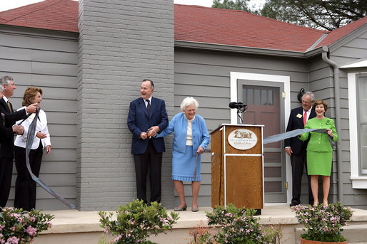 Former President George H.W. Bush and Mrs. Barbara Bush share a laugh with Mrs. Laura Bush and Midland friends, George Scott, Jan O’Neill, and Joe O’Neill, after cutting the ribbon on Tuesday, April 11, 2006, at the dedication of the President George W. Bush’s Childhood Home in Midland, Texas. White House photo by Shealah Craighead