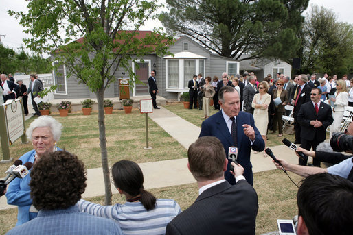 Former President George H.W. Bush and Mrs. Barbara Bush talk with members of the press on April 11, 2006, after the dedication and ribbon cutting ceremony for the opening of President George W. Bush’s Childhood Home in Midland, Texas. White House photo by Shealah Craighead