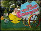 Guests pose for photos at a decorative display on the South Lawn of the White House during the 2006 White House Easter Egg Roll, Monday, April 17, 2006. The first White House Easter Egg Roll was held in 1878. White House Photo by Julie Kubal 