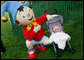 A small child looks up skeptically toward the PBS character Noddy, entertaining kids at the 2006 White House Easter Egg Roll, Monday, April 17, 2006 on the South Lawn of the White House. White House Photo by Julie Kubal 