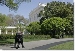 President George W. Bush walks with Prime Minister Fouad Siniora of Lebanon after addressing the press on the South Lawn Tuesday, April 18, 2006. "Well, we just had a really interesting discussion. I told the Prime Minister that the United States strongly supports a free and independent and sovereign Lebanon. We took great joy in seeing the Cedar Revolution," said President Bush. "We understand that the hundreds of thousands of people who took to the street to express their desire to be free required courage, and we support the desire of the people to have a government responsive to their needs and a government that is free, truly free." White House photo by Paul Morse