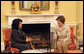 Mrs. Laura Bush visits with Mrs. Hoda Siniora, wife of Lebanon Prime Minister Fouad Siniora, during a tea in the Yellow Oval Room of the White House, Tuesday, April 18, 2006. White House photo by Shealah Craighead