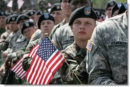 Soldiers listen as Vice President Dick Cheney delivers remarks at a rally at Fort Riley Army Base in Kansas, Tuesday, April 18, 2006. During his address the vice president recognized the 3rd Brigade Combat Team of the 24th Infantry Division by welcoming them home from their recent tour in Iraq and thanking them for their service and support during the Iraqi elections. White House photo by David Bohrer