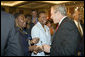 President George W. Bush greets members of the audience after speaking Wednesday, April 19, 2006, at Tuskegee University in Tuskegee, Alabama. White House photo by Paul Morse