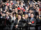 Guests wave enthusiastically as Presidents George W. Bush and Hu Jintao pass by during the South Lawn Arrival Ceremony for the Chinese President, Thursday, April 20, 2006. White House photo by Kimberlee Hewitt