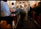 President George W. Bush greets parishioners at the end of a church service at the Marine Corps Air Ground Combat Center in Twentynine Palms, California, Sunday, April 23, 2006. White House photo by Eric Draper