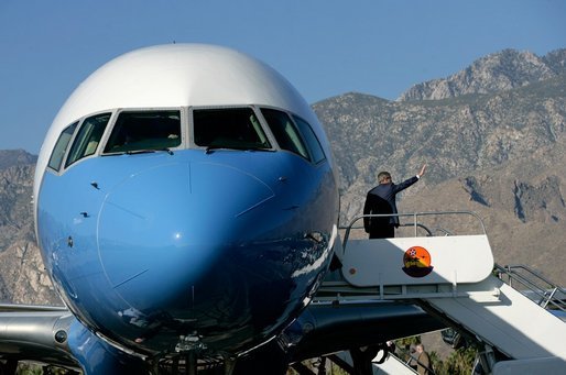 President George W. Bush waves from Air Force One as he prepares to leave Palm Springs for Orange County Monday, April 24, 2006. White House photo by Eric Draper