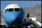 President George W. Bush waves from Air Force One as he prepares to leave Palm Springs for Orange County Monday, April 24, 2006. White House photo by Eric Draper