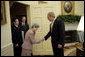 President George W. Bush welcomes Mrs. Sakie Yokota, mother of Megumi Yokota, and her son representing family members of Japanese citizens abducted by North Korea to the Oval Office Friday, April 28, 2006. "I have just had one of the most moving meetings since I've been the President here in the Oval Office. I met with a mom and a brother who long to be reunited with her daughter and his sister," said the President to the press. "They're apart because the North Korean government abducted the child when she was a teenager. And all the mom wants is to be reunited with her daughter." White House photo by Paul Morse