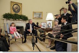 President George W. Bush addresses the press during a meeting with a family of North Korean defectors and family members of Japanese citizens who were abducted by the North Korean government in the Oval Office Friday, April 28, 2006. Kim Han-Mee, the daughter of North Korean defectors, sat next to the President. White House photo by Paul Morse