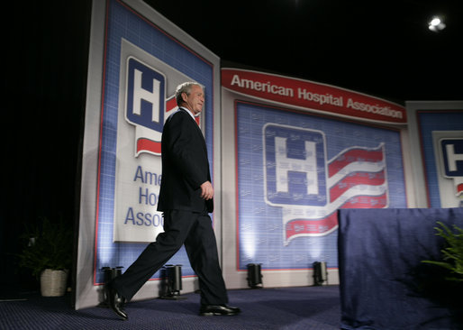 President George W. Bush steps onto the stage at the Washington Hilton Hotel Monday, May 1, 2006, prior to delivering his remarks on health care initiatives. Said the President, "America has the best health care system in the world, pure and simple." White House photo by Paul Morse