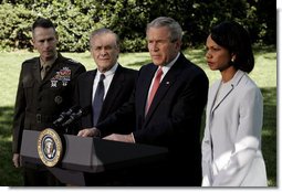 President George W. Bush makes a statement to the press regarding the recent trip to Iraq by Secretary Rumsfeld and Secretary Rice on the South Lawn May 1, 2006. The President is standing with, from left, Chairman of the Joint Chiefs of Staff Peter Pace, Defense Secretary Donald Rumsfeld and State Secretary Condoleezza Rice. White House photo by Eric Draper