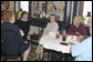 Mrs. Laura Bush and Mrs. Janet Huckabee, left, visit with patrons Tuesday, May 2, 2006 at Bailey’s Bakery in Ft. Smith, Ark. Mrs. Bush traveled to Arkansas to remind seniors of the May 15th enrollment deadline to sign-up for the Medicare Prescription Drug Benefit. White House photo by Kimberlee Hewitt