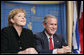 President George W. Bush shares a moment with Chancellor Angela Merkel of the Federal Republic of Germany, during the American Jewish Committee's Centennial Dinner Thursday, May 4, 2006, at the National Building Museum in Washington, D.C. White House photo by Paul Morse