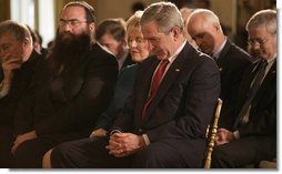 President George W. Bush is joined in prayer by Shirley Dobson, chairman of the National Day of Prayer Task Force, and Rabbi Sholom Ciment, the spiritual leader of Chabad-Lubavitch of Greater Boynton in Palm Beach County, Fla., during a celebration of National Prayer Day at the White House Thursday, May 4, 2006. White House photo by Eric Draper