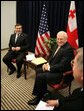 Vice President Dick Cheney and President Mikheil Saakashvili of Georgia, share a light moment with U.S. Ambassador John Tefft, right, during a bilateral meeting held during the Vilnius Conference 2006 in Vilnius, Lithuania, Thursday, May 4, 2006. White House photo by David Bohrer