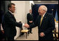 Vice President Dick Cheney and Ukrainian President Viktor Yushchenko greet one another before beginning a breakfast meeting, Thursday, May 4, 2006 in Vilnius, Lithuania. Both leaders have come to Vilnius to participate in the Vilnius Conference 2006, a summit of leaders of the Baltic and Black Sea regions. White House photo by David Bohrer