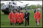 President George W. Bush walks with graduates after arriving at Oklahoma State University in Stillwater, OK where he delivered the commencement address to the class of 2006 on Saturday May 6, 2006. White House photo by Paul Morse