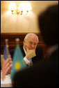 Vice President Dick Cheney listens as leaders of Kazakh opposition political parties share their ideas regarding political and economic reform and the advancement of democracy in Kazakhstan, Saturday, May 6, 2006, during a breakfast meeting in Astana. White House photo by David Bohrer