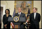 President George W. Bush delivers a statement on Darfur in the Roosevelt Room Monday, May 8, 2006. Standing with the President are State Secretary Condoleezza Rice and State Deputy Secretary Robert Zoellick. "About 200,000 people have died from conflict, famine and disease," said the President. "And more than 2 million were forced into camps inside and outside their country, unable to plant crops, or rebuild their villages. I've called this massive violence an act of genocide, because no other word captures the extent of this tragedy." White House photo by Paul Morse