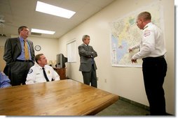 President George W. Bush and Florida Governor Jeb Bush receive a briefing on brush fires at the Hillsborough County Fire Station in Sun City Center, Florida, Tuesday, May 9, 2006. White House photo by Eric Draper