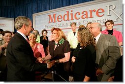 President George W. Bush greets audience members at the end of A Conversation on the Medicare Prescription Drug Benefit at the Asociacion Borinquena de Florida Central, Inc., in Orlando Wednesday, May 10, 2006. White House photo by Eric Draper