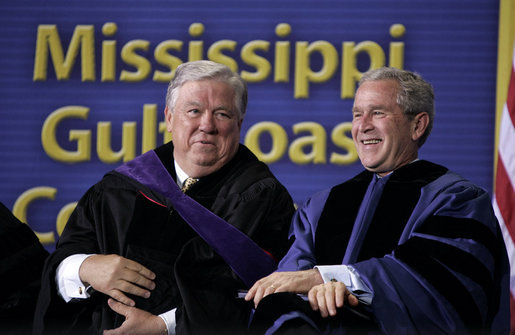 President and Mississippi Governor Haley Barbour attend the 2006 graduation class at Mississippi Gulf Coast Community College in Biloxi, Miss., Thursday, May 11, 2006. "You continued your studies in classrooms with crumbling walls. You lost homes, and slept in tents near campus to finish courses," said the President speaking about the students' experiences. "You cleared debris during the day and you went to class at night." White House photo by Paul Morse