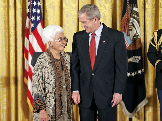 President George W. Bush and Virginia Ganzon-Sturwold of San Francisco exchange glances during the presentation of the President's Volunteer Service Award during a celebration of Asian Pacific American Heritage Month in the East Room Friday, May 12, 2006. White House photo by Paul Morse