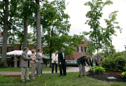 President George W. Bush and Australian Prime Minister John Howard participate in the presentation of White House trees at the Australian Ambassador's Residence, Sunday, May 14, 2006. White House photo by Eric Draper