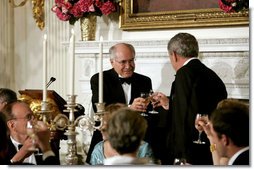 President George W. Bush and Prime Minister John Howard of Australia exchange toasts during an official dinner in the State Dining Room Tuesday, May 16, 2006. White House photo by Paul Morse