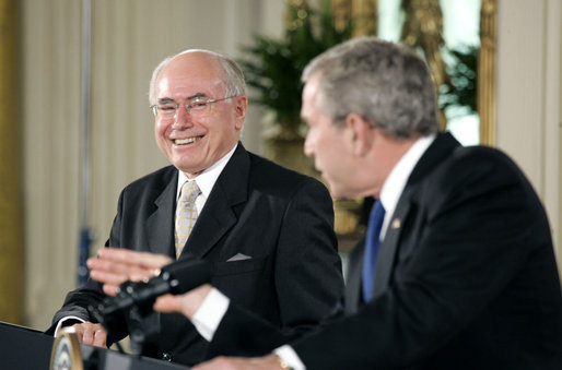 Prime Minister John Howard of Australia smiles at President Bush during their joint press conference in the East Room Tuesday, May 16, 2006. White House photo by Paul Morse