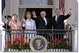 President George W. Bush, Prime Minister John Howard, Mrs. Laura Bush and Mrs. Janette Howard wave from the South Portico of the White House during the State Arrival Ceremony on the South Lawn Tuesday, May 16, 2006. White House photo by Paul Morse