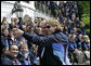 President George W. Bush poses for a photo after delivering congratulatory remarks to the 2006 U.S. Winter Olympic and Paralympic teams during a ceremony held on the South Lawn of the White House Wednesday, May 17, 2006. White House photo by Eric Draper