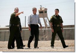 President George W. Bush tours the Yuma sector near the U.S. Mexico border led by Chief Patrol Agent Ronald Colburn, left, and Chief of the Border Patrol David Aguilar in Yuma, Arizona, Thursday, May 18, 2006. White House photo by Eric Draper