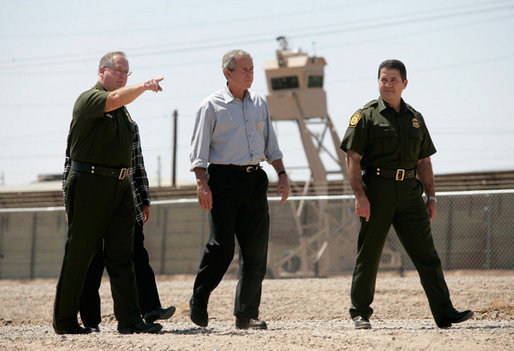 President George W. Bush tours the Yuma sector near the U.S. Mexico border led by Chief Patrol Agent Ronald Colburn, left, and Chief of the Border Patrol David Aguilar in Yuma, Arizona, Thursday, May 18, 2006. White House photo by Eric Draper