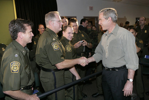 President George W. Bush greets U.S. Border Patrol agents after delivering remarks on border security and immigration reform at the U.S. Border Patrol Yuma Sector Headquarters in Yuma, Arizona, Thursday, May 18, 2006. White House photo by Eric Draper