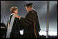 Dr. Roy Nirschel, President of Roger Williams University, thanks Mrs. Laura Bush for delivering the commencement speech at Roger Williams University on Saturday, May 20, 2006, in Bristol, Rhode Island. Mrs. Bush was awarded an honorary doctorate in education from Roger Williams University. White House photo by Shealah Craighead